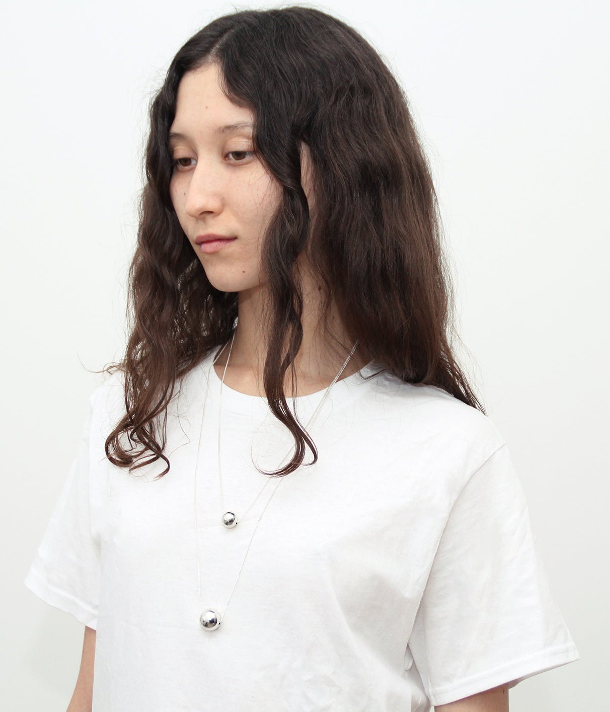 Solar silver sphere necklace in Brooklyn New York by designer llayers 
