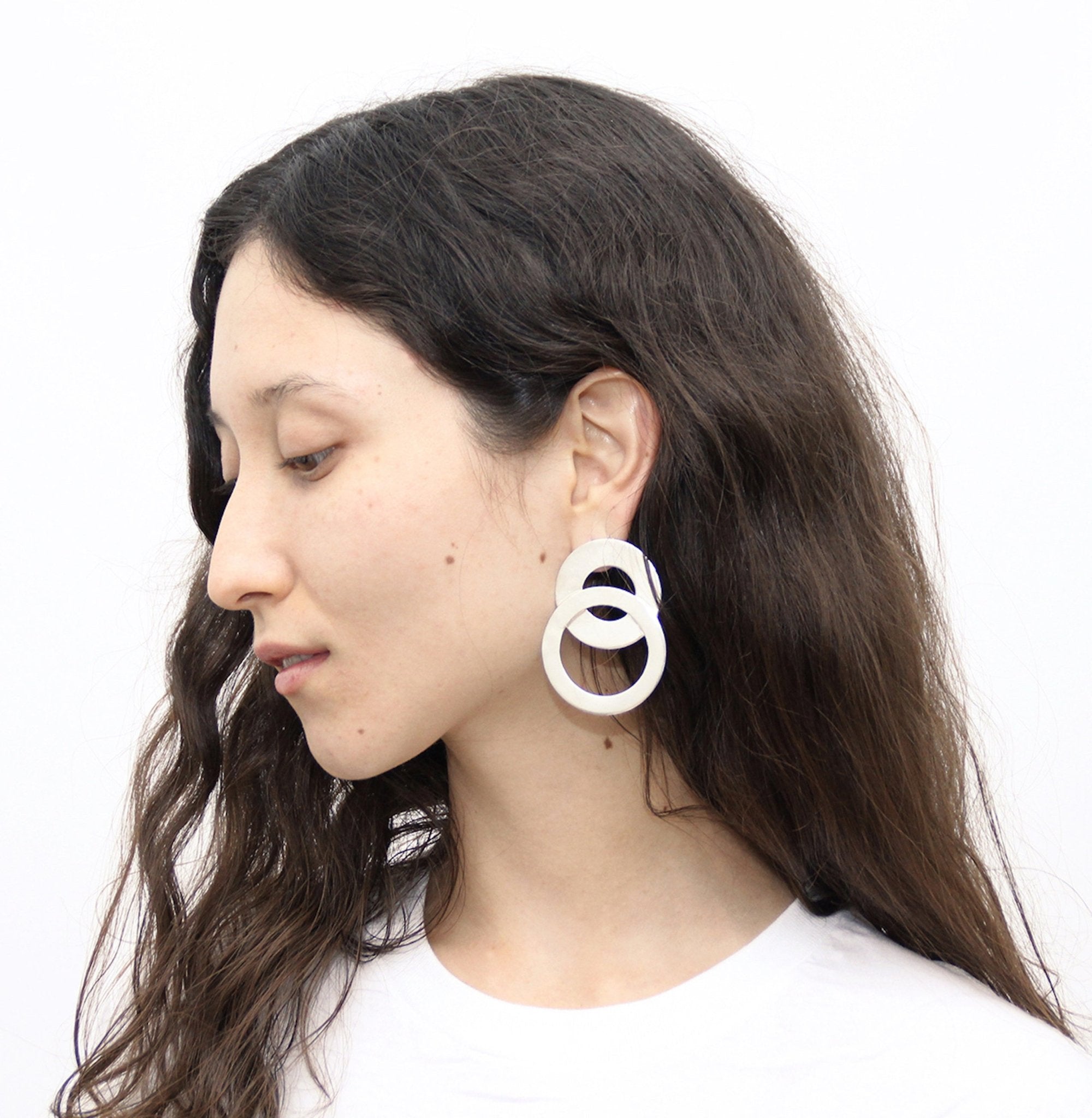 statement oversize infinity circle earrings silver handmade by llayers in Brooklyn New York